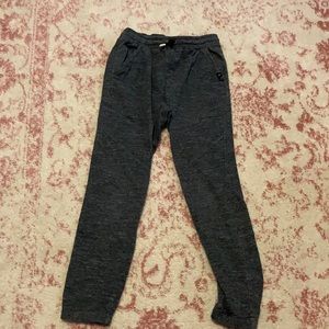 Dark gray sweatpants.